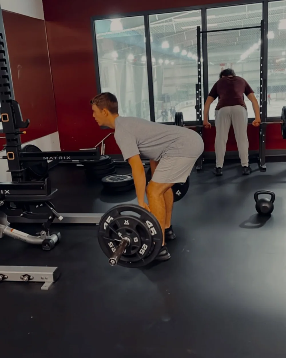 Mount Academy hockey players trap bar deadlifting in their school gym